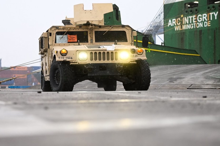 A Humvee military vehicle shows off its armor and turret. 