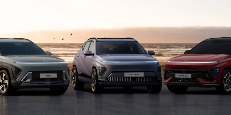 The 2024 Hyundai Kona subcompact SUVs are parked by the ocean. 