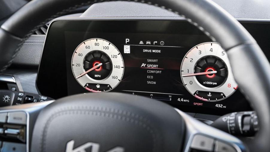 The driver's display of the 2023 Kia Telluride which presents menus and ADAS safety feature information