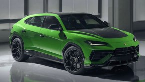 A green Lamborghini Urus Performante small luxury performance SUV is parked.