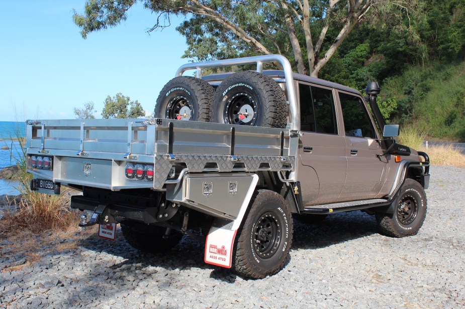 This is a Toyota Land Cruiser truck with an aluminum aftermarket Australian-style utility or ute bed made by NorWeld.