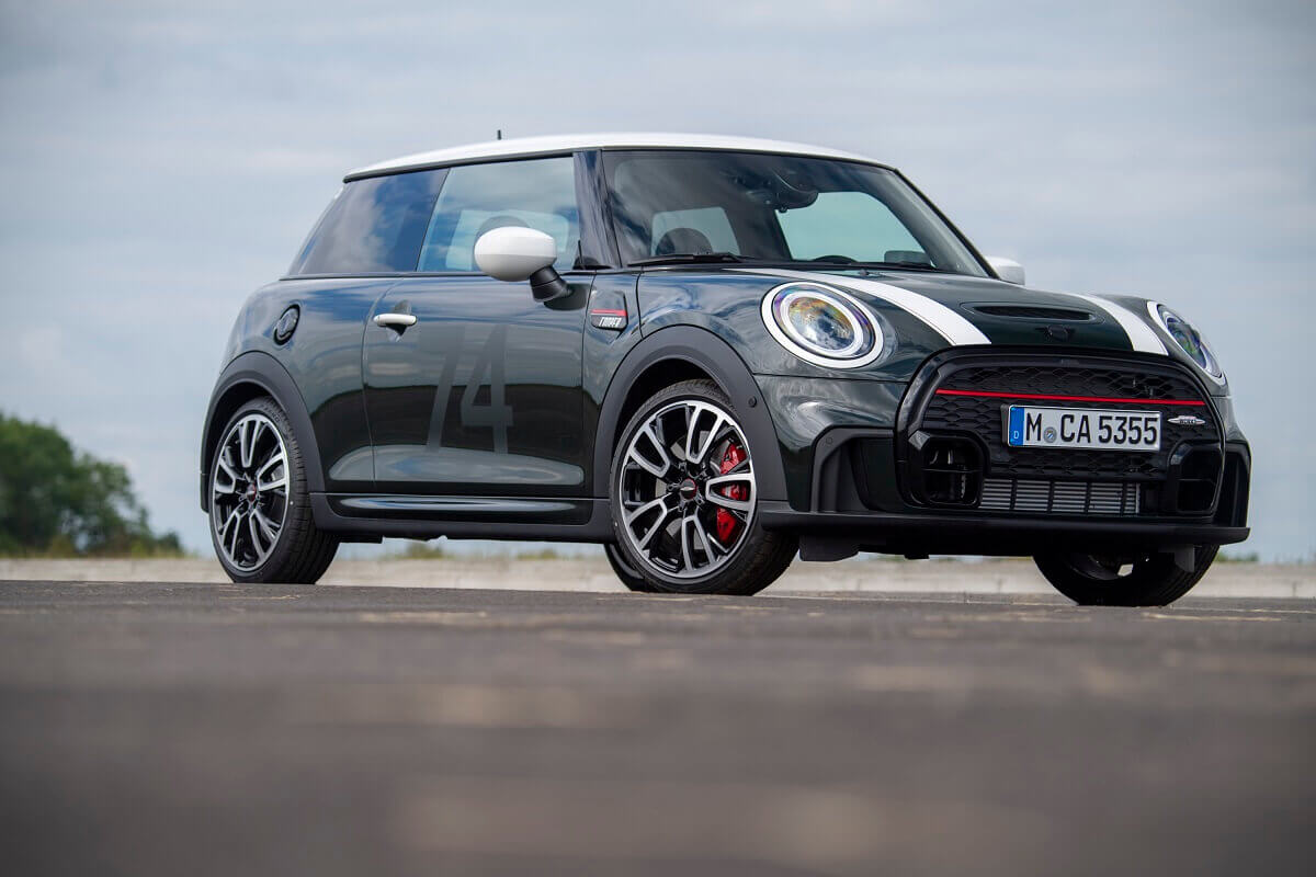 A MINI Cooper John Cooper Works hot hatchback shows off its livery and hatchback styling.