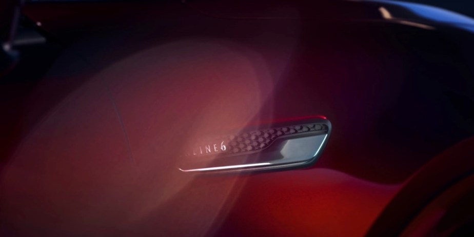 A red Mazda CX-90 midsize SUV. 