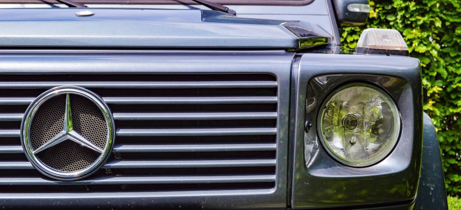 Closeup of the grille of a gray Mercedes-Benz G Wagon SUV which has been known to experience engine sensor problems.