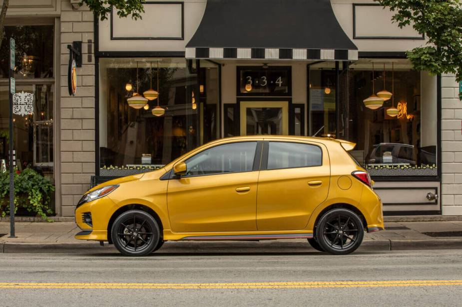A 2023 Mitsubishi Mirage shows off its hatchback car lines and gold paintwork.