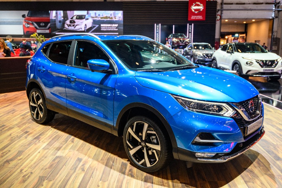 A Nissan Rogue SUV is on display at an auto show. The Rogue is one of the best used SUVs for under $30,000