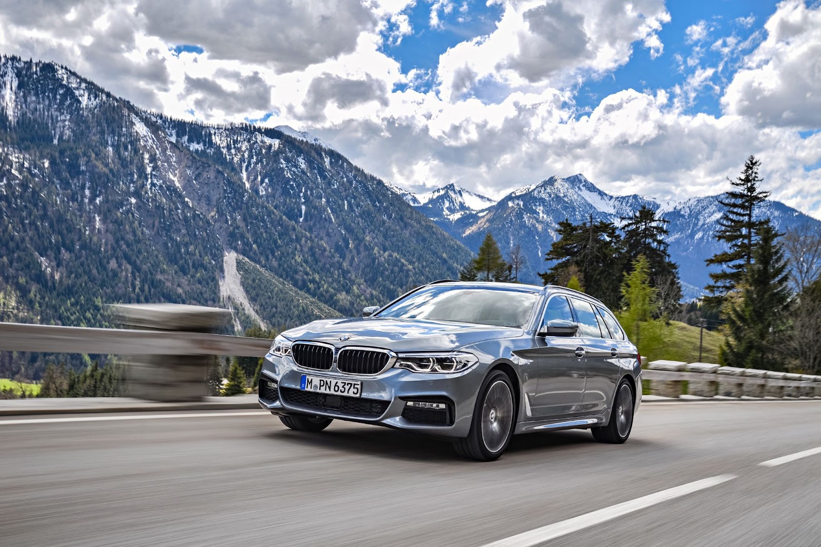 BMW 5 Series on a mountain road