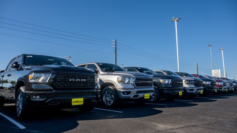 Ram 1500 full-size pickup truck models on the Mak Haik dealership lot in Houston, Texas
