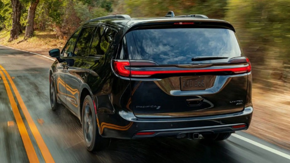 Rear angle view of black 2023 Chrysler Pacifica minivan