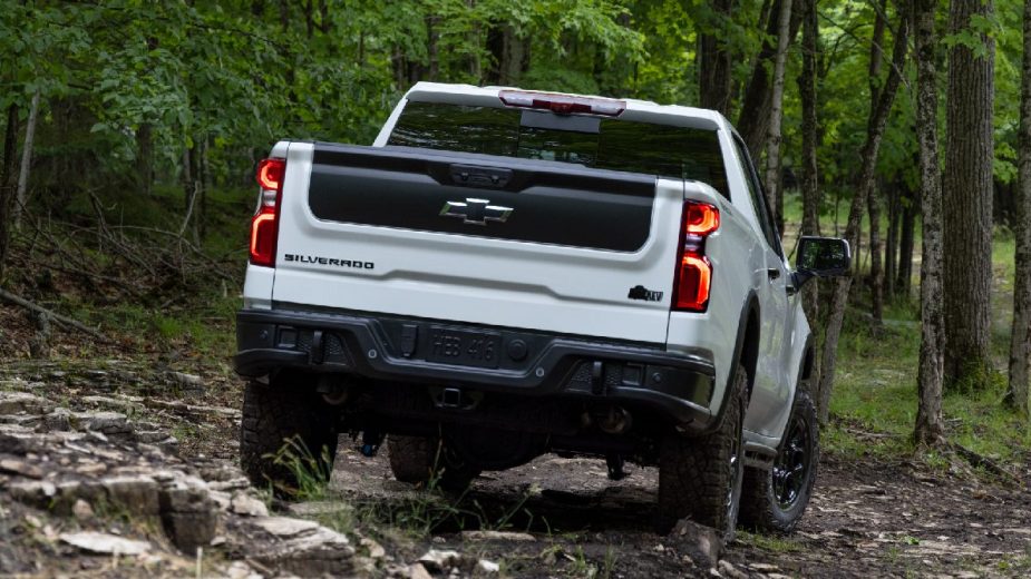 Rear angle view of new 2023 Chevy Silverado 1500 ZR2 Bison full-size truck, showing how much fully loaded one costs