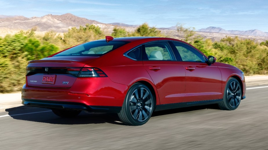 Rear angle view of red 2023 Honda Accord midsize sedan