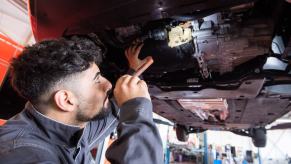A mechanic possibly fixing an already recalled repair