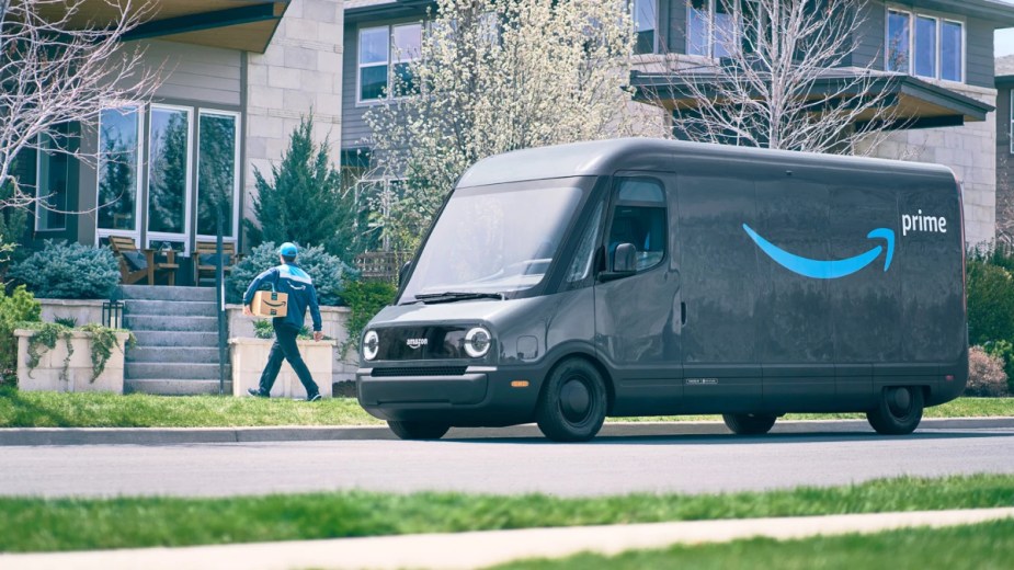Amazon's delivery van, the Rivian EDV, makes a delivery in a local neighborhood. 