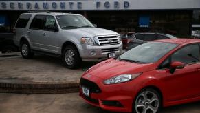 A Ford SUV and sedan on display at the Serramonte Ford dealership in Colma, California