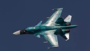 A Sukhoi Su-34 jet fighter-bomber, often nicknamed the 'Hellduck,' during a demonstration flight