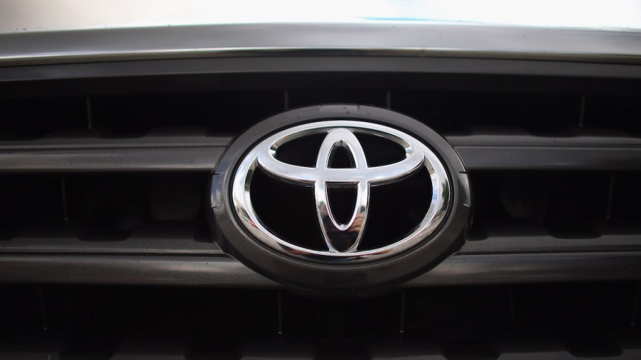 A Toyota logo, maker of the Toyota Tundra.