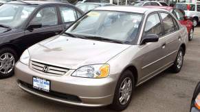 A 2001 Honda Civic on display at a car sales lot.