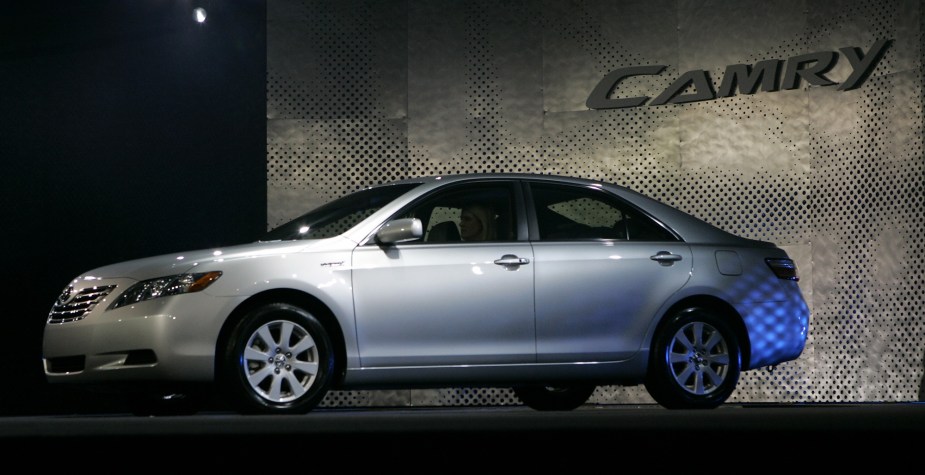 A used Toyota Camry, the automaker's famous long lasting model, sits on a stage. 