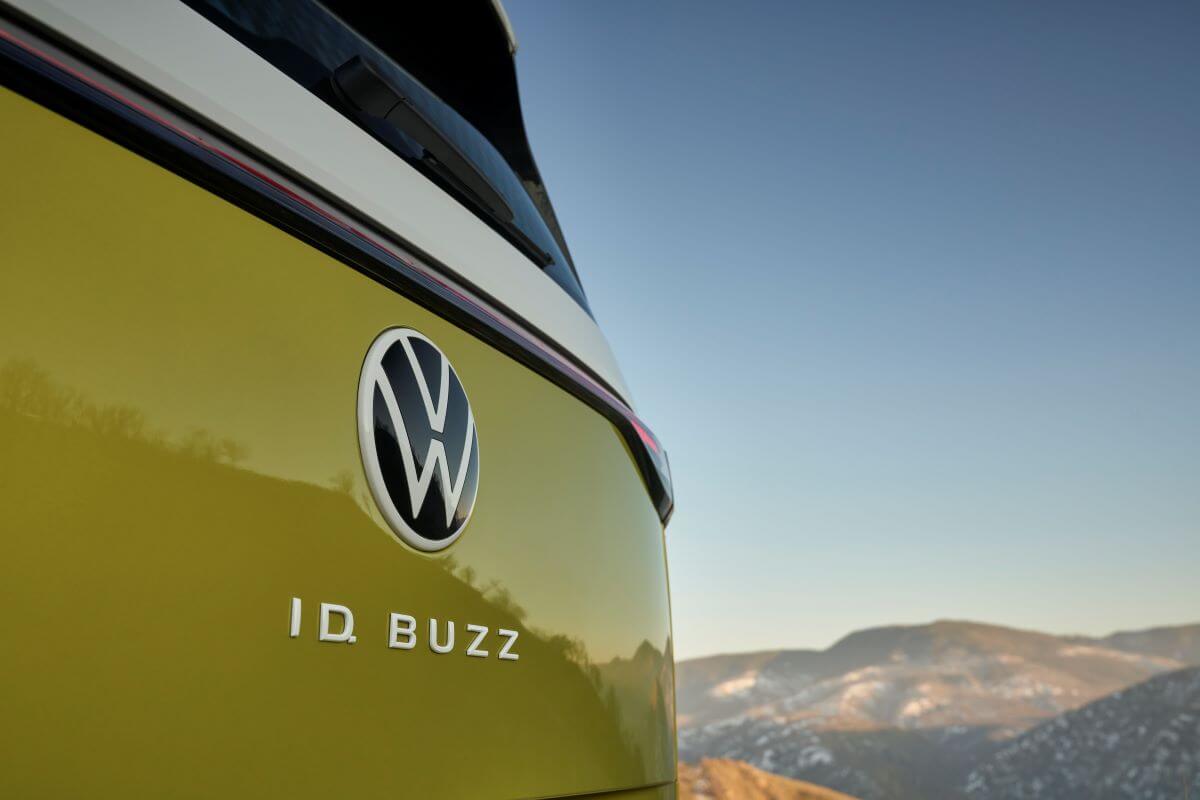 ID. BUZZ rear model badging on a yellow Volkswagen ID. Buzz all-electric microbus model