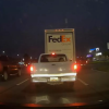 A white truck following a FedEx truck before hitting it. Waze app seemed to predict the crash.