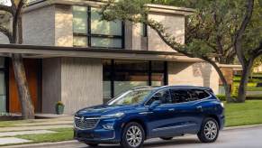 The best midsize American SUVs include this blue 2023 Buick Enclave
