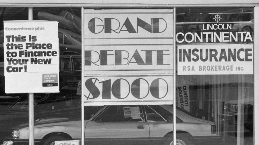 Car leasing and financing signs seen in the 1980s at a Lincoln Continental showroom