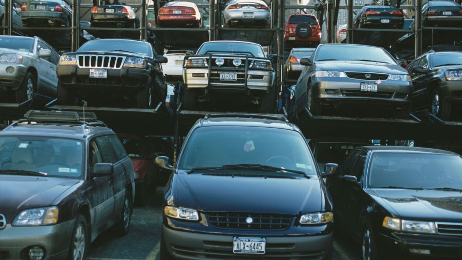Cars, SUVs, and minivans parked in a Manhattan lot
