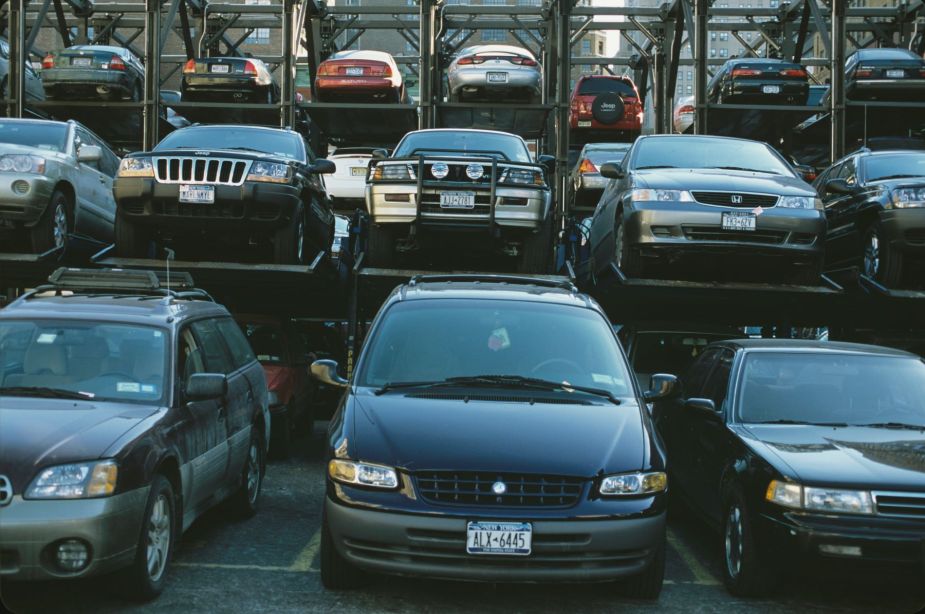Cars, SUVs, and minivans parked in a Manhattan lot