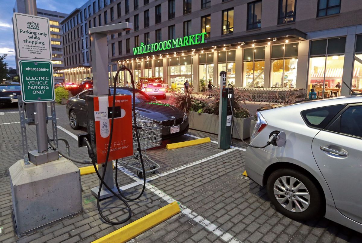 electric car charging outside of a Whole Foods