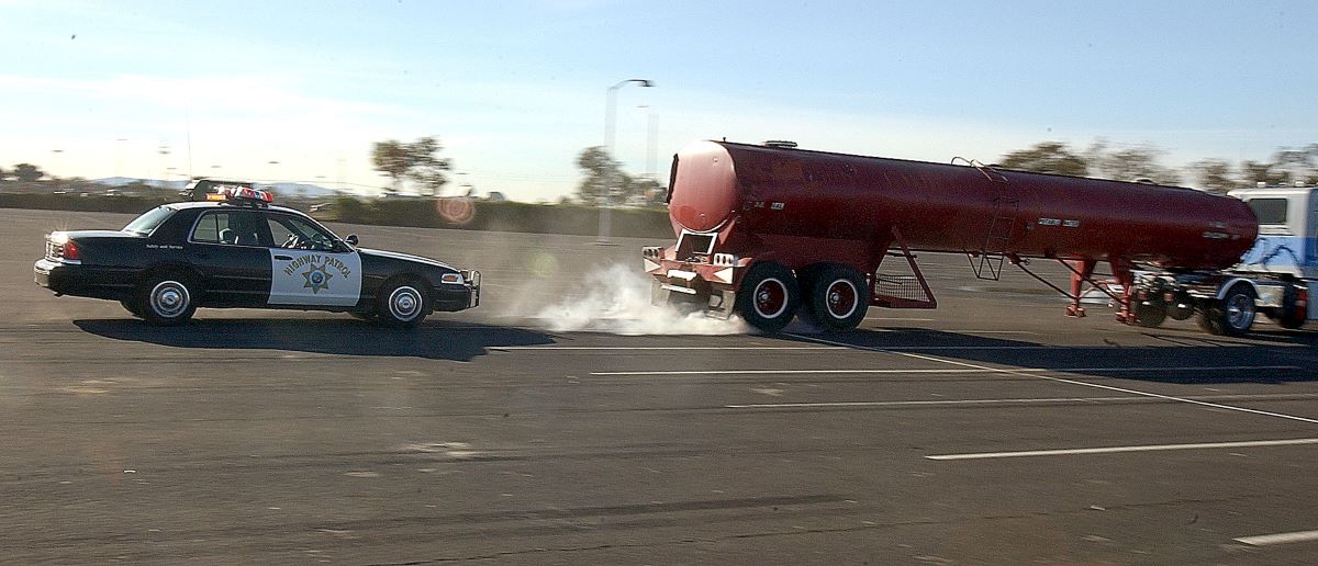 California Highway Patrol officers helping test a prototype semi-truck with shut-off locked brakes