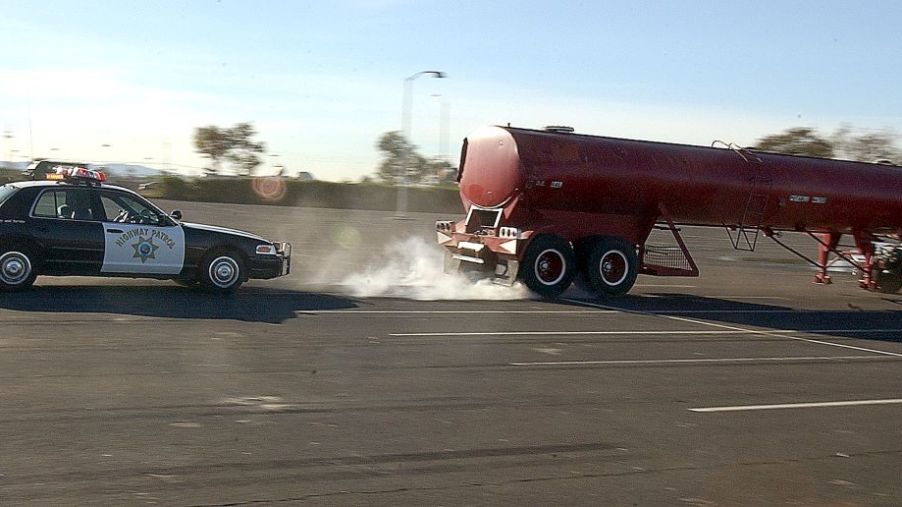 California Highway Patrol officers helping test a prototype semi-truck with shut-off locked brakes