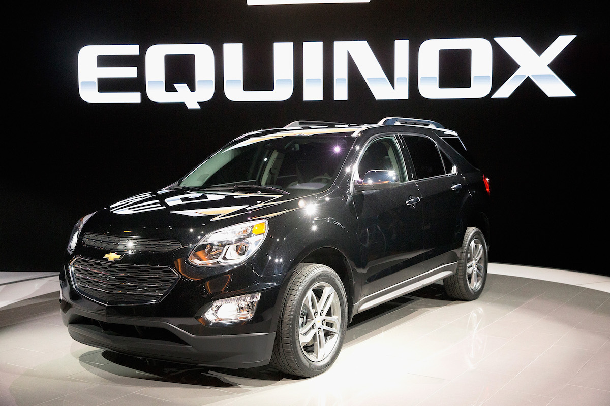A black used Chevy Equinox parked indoors.