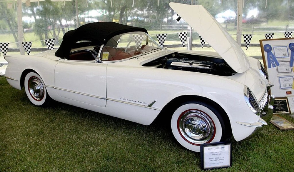 A white 1953 Chevy Corvette roadster shows off its inline-6 Blue Flame engine. 