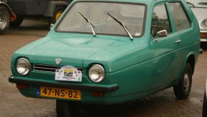Green 1977 Reliant Robin parked