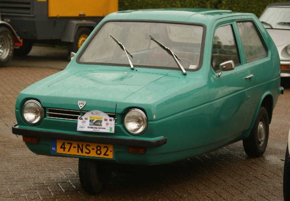 Green 1977 Reliant Robin parked 