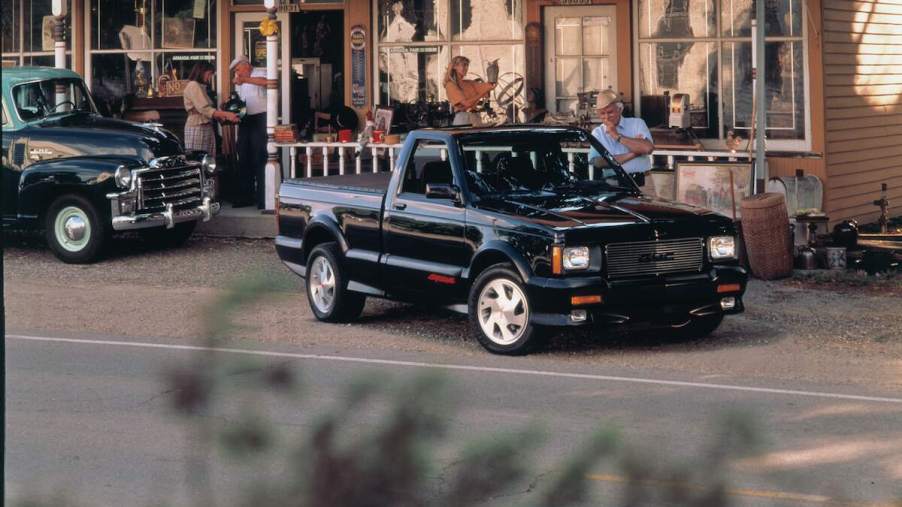 A black 1991 GMC Syclone parked outdoors.