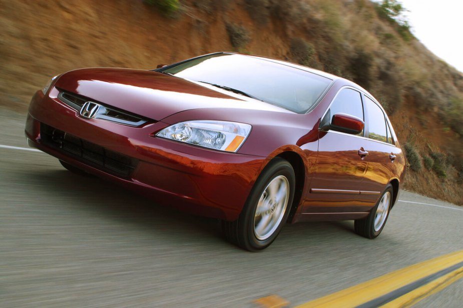 A red 2003 Honda Accord shows off its model's simple styling.