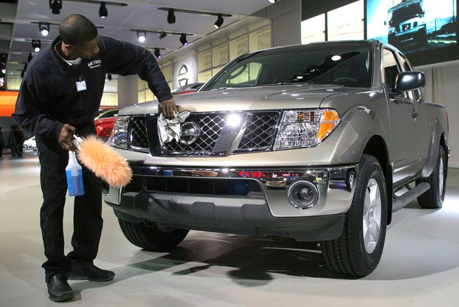 A 2005 Nissan Frontier on display at an auto show.