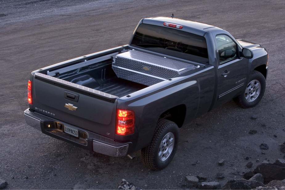 The bed and in-bed toolbox of a Chevrolet Silverado 1500 pickup truck.