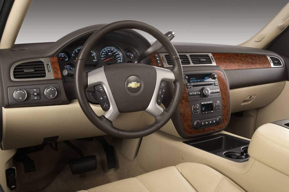 The leather and wood interior of a 2010 Chevrolet Silverado.