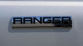 Badging on a white Ford Ranger XLT midsize pickup truck at the Serramonte Ford dealership