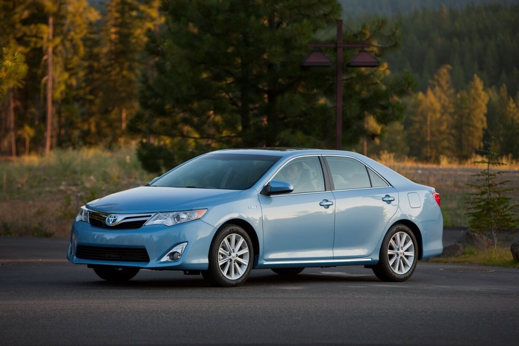 A blue 2012 Toyota Camry Hybrid shows off its bright color. 