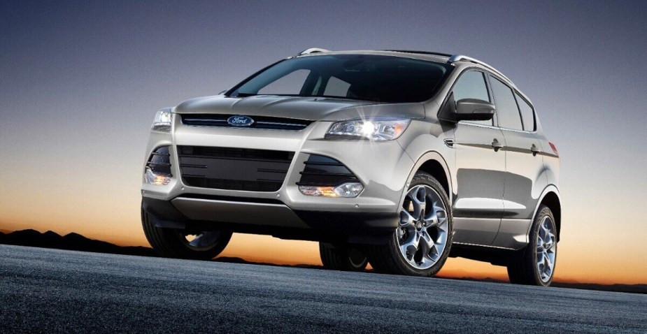 A silver 2014 Ford Escape shows off its LED lights and front-end styling.