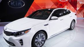 A white Kia Optima sits on the floor of an auto show. The Optima is among various models at risk for theft after a viral TikTok trend.