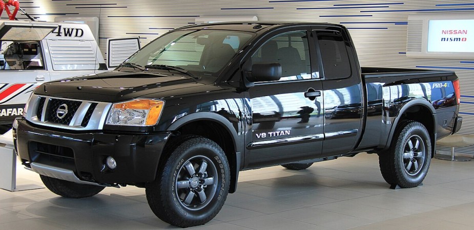 A 2015 Nissan Titan full-size truck sits in a display room.