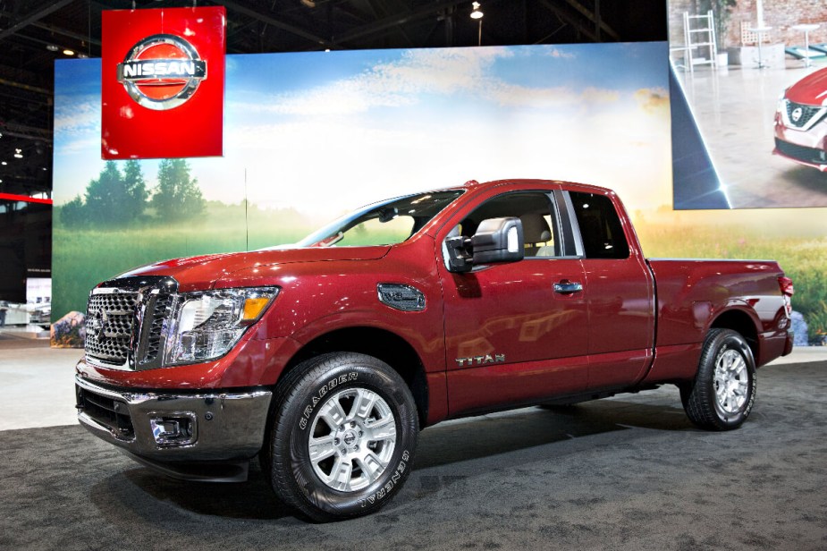 A red Nissan Titan from 2017 sits on display.