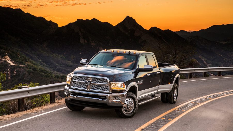 Advertising photo of the final manual transmission stick shift pickup truck, the 2018 Cummins-powered Ram 3500, parked in front of a sun set.