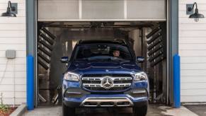 A blue 2020 Mercedes-Benz GLS 450 4MATIC full-size luxury SUV model exiting a car wash