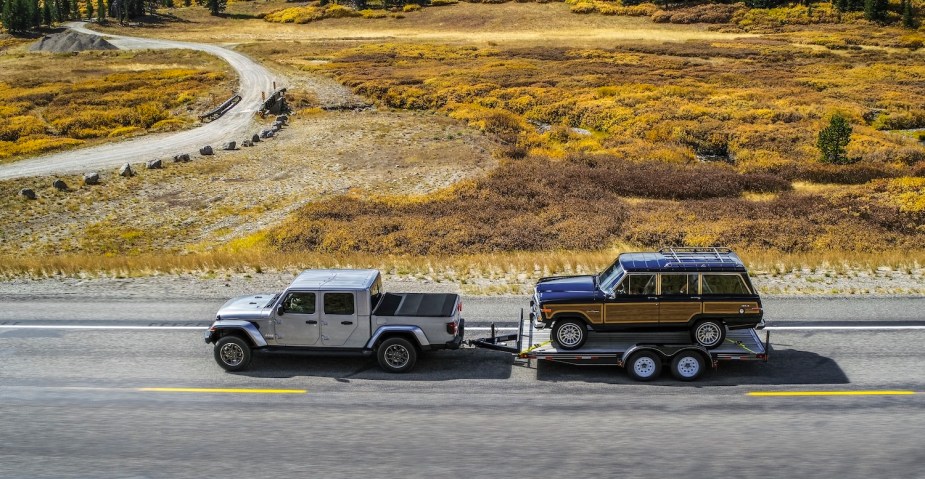 Jeep Gladiator towing a classic Wagoneer SUV.