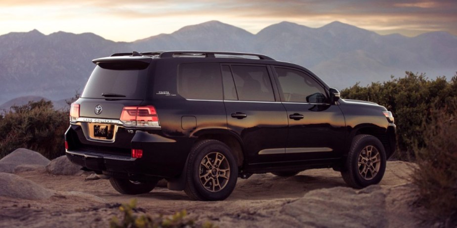 A black 2021 Toyota Land Cruiser full-size SUV is parked. 